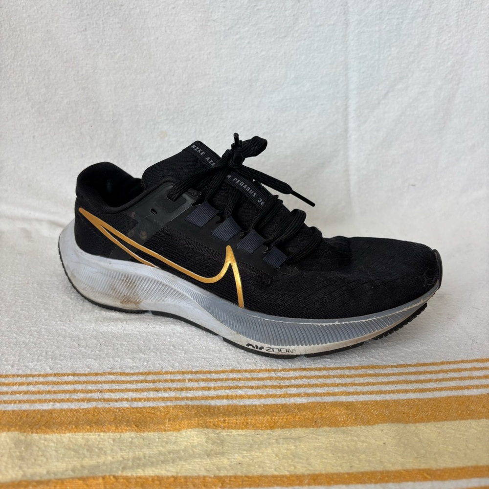 Nike Black and Gold Athletic Shoes with Cushioned Midsole